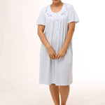 Model wearing Schrank Embroidered Short Sleeve Nightie Blue, front view, showing soft jersey knit and pretty embroidery, available at The Foundation.