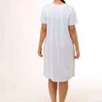 Back view of Schrank Embroidered Short Sleeve Nightie Blue, model showing soft gathering and short length, featured at The Foundation.