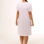 Back view of Schrank Embroidered Short Sleeve Nightie Pink, model showing soft gathering detail and short length, featured at The Foundation.