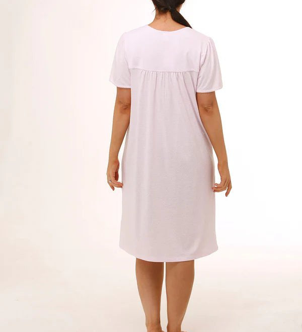 Back view of Schrank Embroidered Short Sleeve Nightie Pink, model showing soft gathering detail and short length, featured at The Foundation.