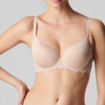 Model wearing Simone Perele Caresse 3D Plunge T-Shirt Bra in Peau Rose, showcasing full front design with soft cups and lace details.