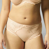 Close up of Simone Pérèle Caresse Culotte Brief in Peau Rose, shown on model, featuring full coverage lace and silky microfibre front.