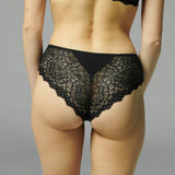 Back view of Caresse Shorty in Black, showcasing seamless microfibre finish and curve-hugging lace design.