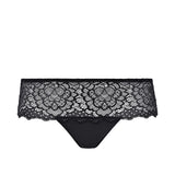 Flat lay of Simone Pérèle Caresse Shorty Brief in Black, highlighting soft floral lace and sleek mid-rise shape.