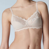 Model in Simone Perele Caresse Soft Cup Bra Peau Rose with lace detail—The Foundation