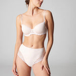 Full body shot of model in Simone Perele Delice Culotte Brief blush – styled with matching bra.