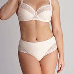 Model wearing Delice Control Full Cup Bra in blush with full coverage support and elegant embroidery.