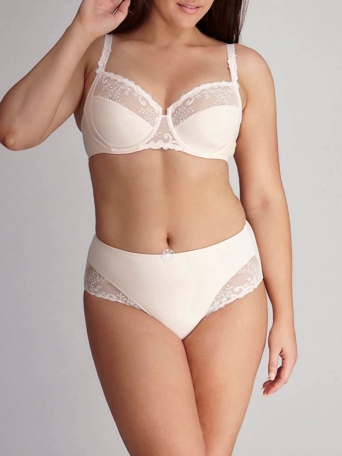 Model wearing Delice Control Full Cup Bra in blush with full coverage support and elegant embroidery.