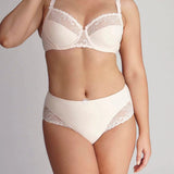 Model wearing Delice Control Full Cup Bra in blush with full coverage support and elegant embroidery.