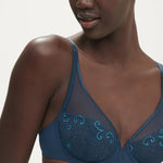 Close up of Delice Plunge Bra in Prestige Blue showcasing delicate embroidery, supportive cups, and low neckline.