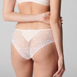 Back view of Delice Shorty Brief Blush, showing cheeky bottom coverage and sheer embroidered panel