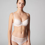 Model wearing Delice Shorty Brief Blush, highlighting mid-rise fit and boy short cut