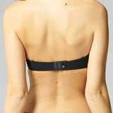 Model wearing Simone Pérèle Delice Strapless Bra in Moonlight from The Foundation, featuring smooth microfibre cups and embroidered tulle detailing. back view