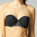 Model wearing Simone Pérèle Delice Strapless Bra in Moonlight from The Foundation, featuring smooth microfibre cups and embroidered tulle detailing. front view