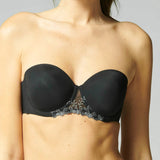 Model wearing Simone Pérèle Delice Strapless Bra in Moonlight from The Foundation, featuring smooth microfibre cups and embroidered tulle detailing. front view