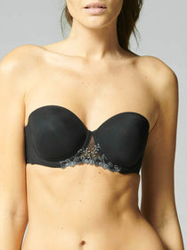 Model wearing Simone Pérèle Delice Strapless Bra in Moonlight from The Foundation, featuring smooth microfibre cups and embroidered tulle detailing. front view