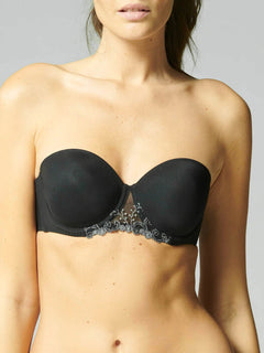 Model wearing Simone Pérèle Delice Strapless Bra in Moonlight from The Foundation, featuring smooth microfibre cups and embroidered tulle detailing. front view