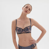 Confident model wearing Simone Perele Intrigue Half Cup Bra Cinder Blue, paired with matching briefs, chic and contemporary at The Foundation.