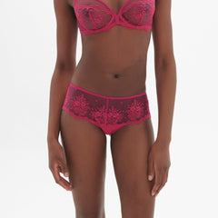 Model wearing Intrigue Shorty Brief Disco Pink by Simone Perele, front view showing bouquet embroidery and sheer tulle from The Foundation.