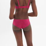 Back view of model in Intrigue Shorty Brief Disco Pink by Simone Perele, featuring soft tulle and sexy fit from The Foundation.