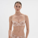 Front view of Simone Perele Saga Half Cup Bra in Pink Nude, featuring sheer embroidery and lace—luxury lingerie at The Foundation.