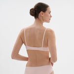 Back view of Saga Half Cup Bra Pink Nude, Simone Perele lingerie with soft microfiber band, available at The Foundation.