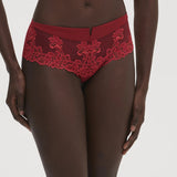 Front view of Saga Shorty Brief Lipstick by Simone Perele from The Foundation, showing rich red colour and detailed guipure lace