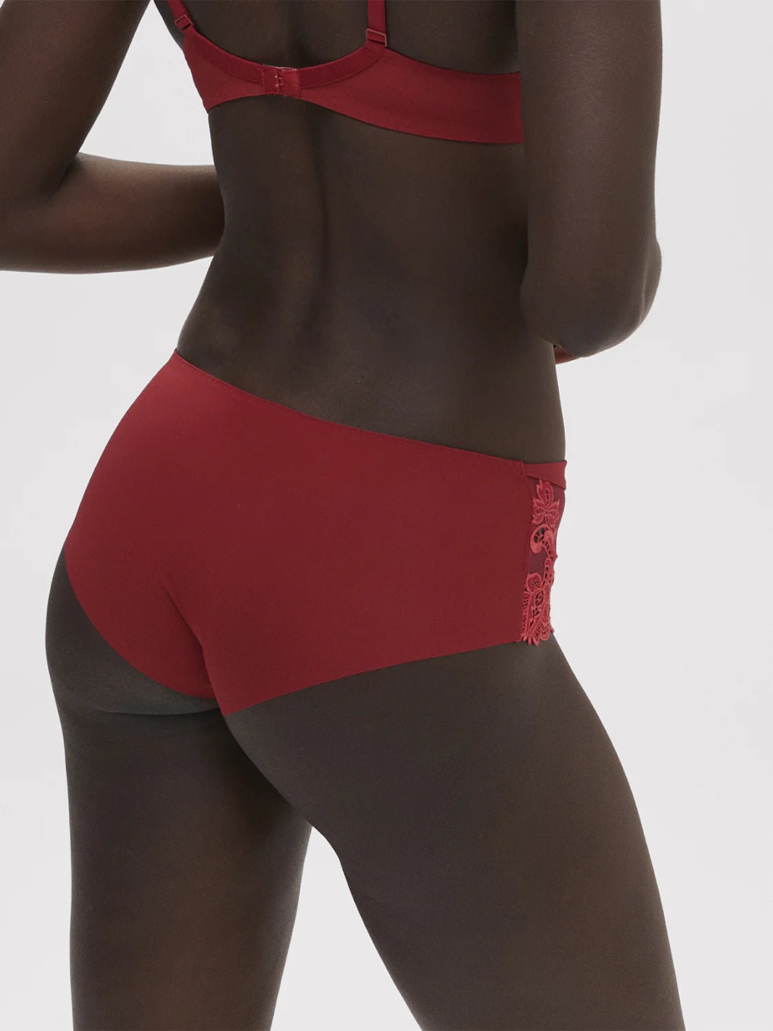Side angle of model in Saga Shorty Brief Lipstick by Simone Perele from The Foundation, showing mid-rise fit and comfortable waistband