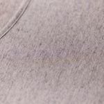 Close-up of the grey marle knit fabric of Modal Cashmere Long Sleeve Top, showing soft cashmere blend and fine Italian craftsmanship.