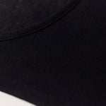 TBL Modal Cashmere Long Sleeve Top in Black with scoop neckline and lightweight Italian-made thermal fabric – available at The Foundation (close up)