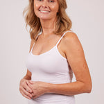 Woman wearing a white modal camisole by EGI, showcasing front view and relaxed, fitted design.