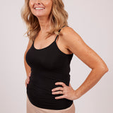 Woman wearing a black EGI modal camisole, showing front view and comfortable fit.