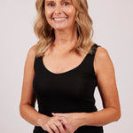 Woman in black EGI modal tank top, showcasing front fit with scoop neckline.