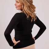 Side profile of black modal EGI polo neck top showing flattering stretch and smooth texture.