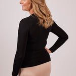 Side view of Modal Long Sleeve High Neck Top in black, highlighting the sleek silhouette and layering potential for cool days.