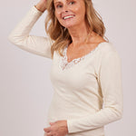 Wool & Cotton Doubleface Long Sleeve Top in ivory, worn by model lifting arm to show natural stretch and layered fit.