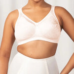 Front view of Triumph Endless Comfort Wirefree Bra in Fresh Powder with soft full cups and wide straps—available now at The Foundation.