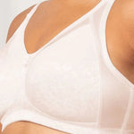 Close-up of Triumph Wirefree Bra in Fresh Powder showing flower embroidery and lightly-padded comfort straps—available exclusively at The Foundation.
