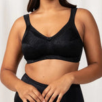 Model wearing the Triumph Endless Comfort Wirefree Bra in Black, showcasing full-coverage fit—available at The Foundation.