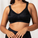 Model wearing the Triumph Endless Comfort Wirefree Bra in Black, showcasing full-coverage fit—available at The Foundation.