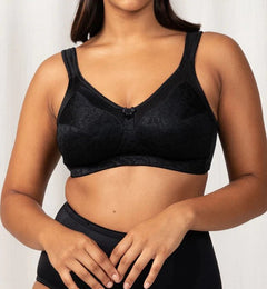 Model wearing the Triumph Endless Comfort Wirefree Bra in Black, showcasing full-coverage fit—available at The Foundation.