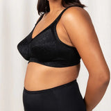 Side view of the Endless Comfort Wirefree Bra in Black by Triumph, featuring wide padded straps—shop now at The Foundation.