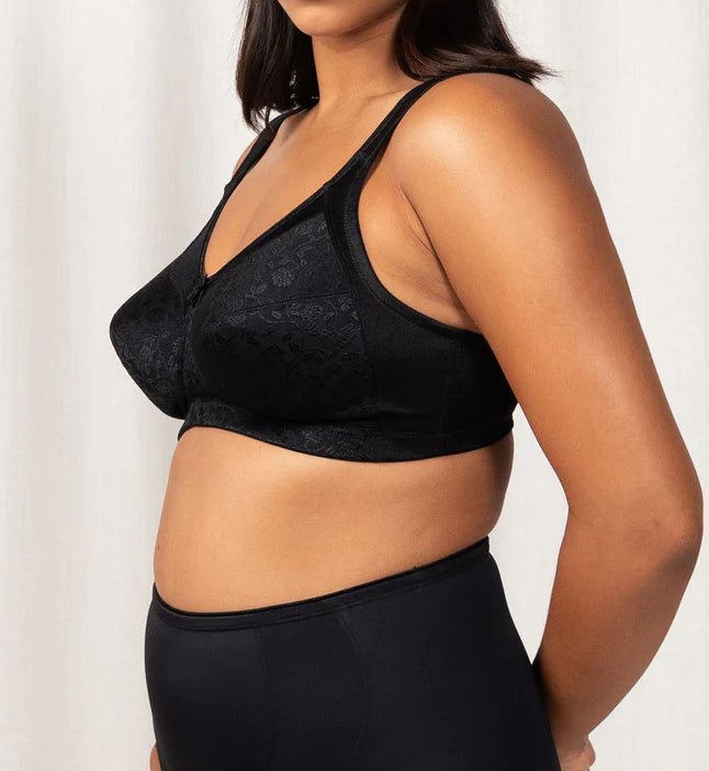 Side view of the Endless Comfort Wirefree Bra in Black by Triumph, featuring wide padded straps—shop now at The Foundation.