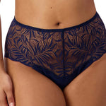 Front view of Triumph Essential Lace Maxi Brief Navy on model showing full coverage fit and sheer navy lace detailing.