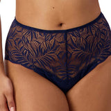Front view of Triumph Essential Lace Maxi Brief Navy on model showing full coverage fit and sheer navy lace detailing.