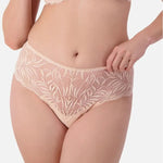 Front view of Triumph Essential Lace Maxi Brief Nude Pink on model showing sheer lace design and comfortable full coverage fit.