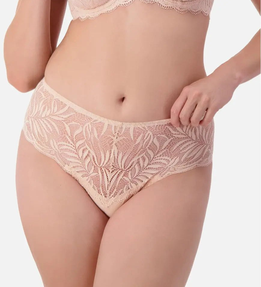 Front view of Triumph Essential Lace Maxi Brief Nude Pink on model showing sheer lace design and comfortable full coverage fit.