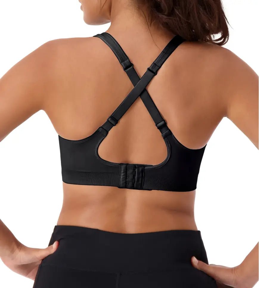 Triumph Triaction Ultra Seamfree Top Black, back view, cross-back straps, breathable and supportive sports bra for women, Triaction by Triumph.