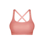 Triaction Ultra Seamfree Top in Salsa Pink by Triumph shown on model, wireless activewear crop with cross-back straps and double-layered support 