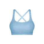 Flat lay of Triumph Triaction Ultra Seamfree Top Sky Blue, seamless sports bra, moisture-wicking activewear, cross-back detail, new limited edition colour.